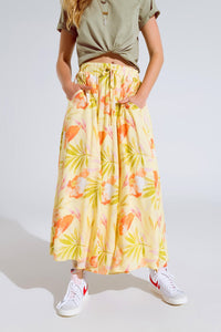 saia maxi amarela com estampado tropical